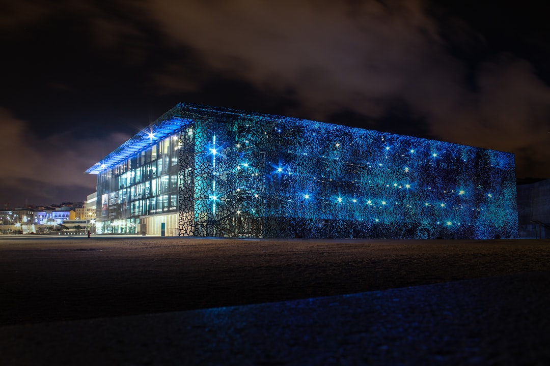 brown-concrete-building-under-white-clouds-during-daytime-gqknw2rvnue